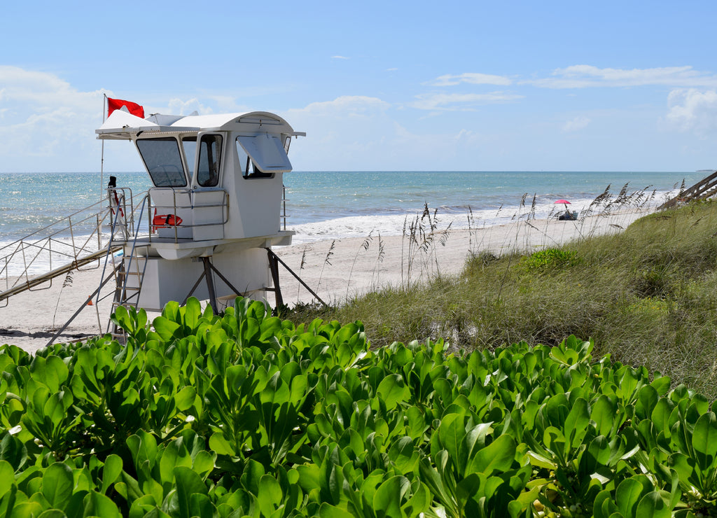 Beach with lifeguard stand, sunny day in Vero Beach, Florida