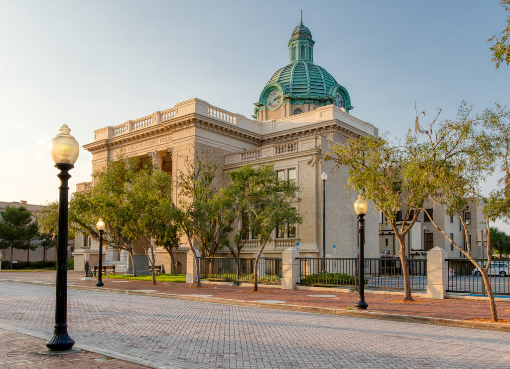 Historic Volusia County Courthouse with copper dome clock street view in DeLand, Florida