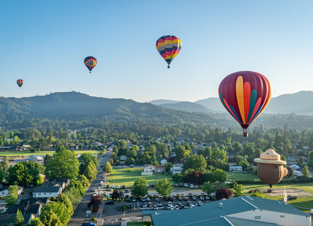 Colorful hot air balloons over Grants Pass Oregon on a beautiful summer morning