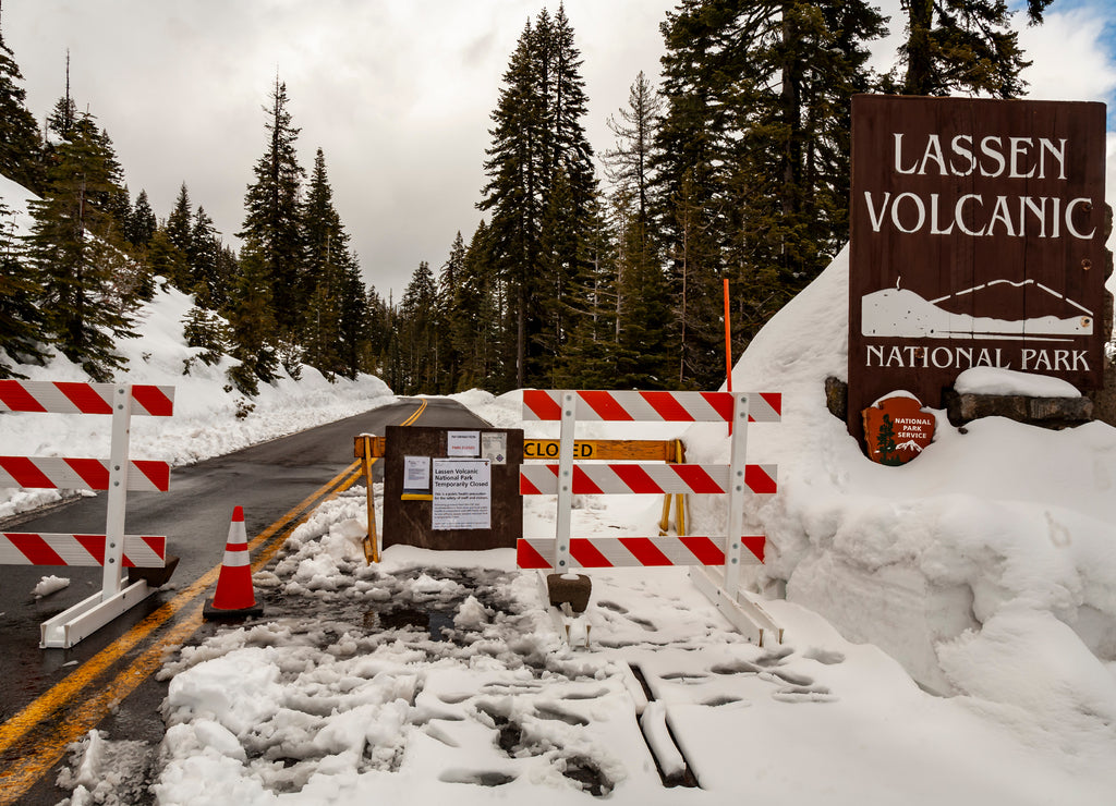 Signs and barricades notify would-be visitors of the closure of Lassen Volcanic National Park, California