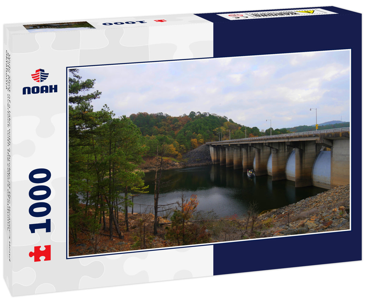 Wide shot of a lake with a bridge at the Beaver’s Bend State Park overlook with the colors of autumn, Oklahoma