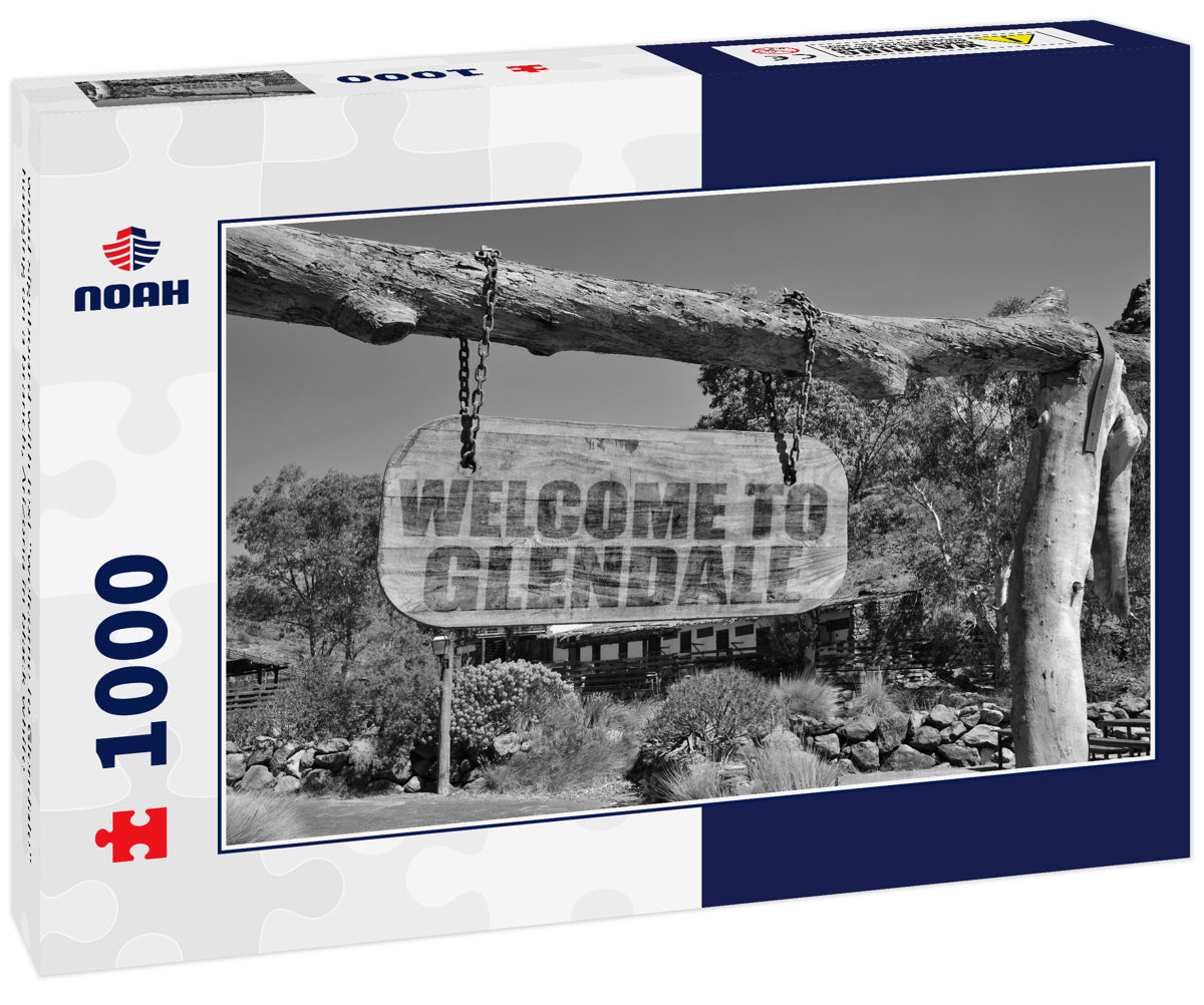 wood signboard with text "welcome to Glendale" hanging on a branch, Arizona in black white