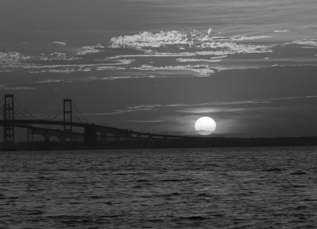 Chesapeake Bay Bridge at Sunset. Anne Arundel County, Maryland. Seen from Terrapin Beach Park in black white