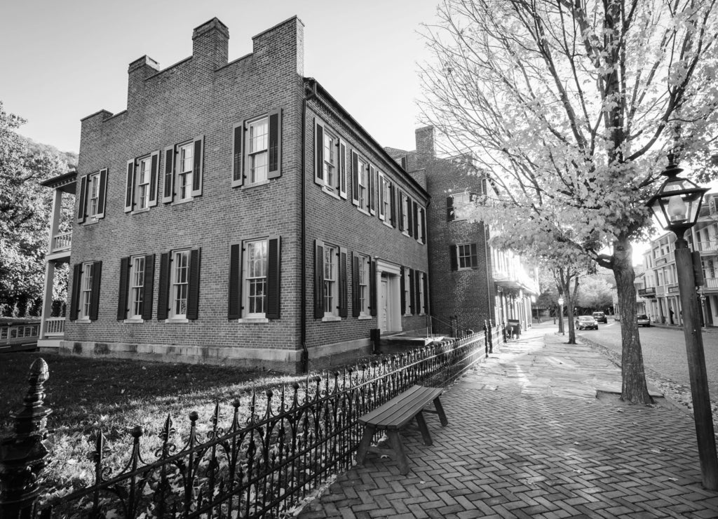 Autumn color and buildings on Shenandoah Street, in Harpers Ferry, West Virginia in black white