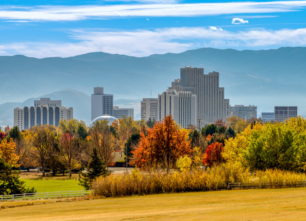 City of Reno downtown skyline cityscape with Hotels, Casinos and skyscrapers during Autumn with vibrant colored trees, Nevada