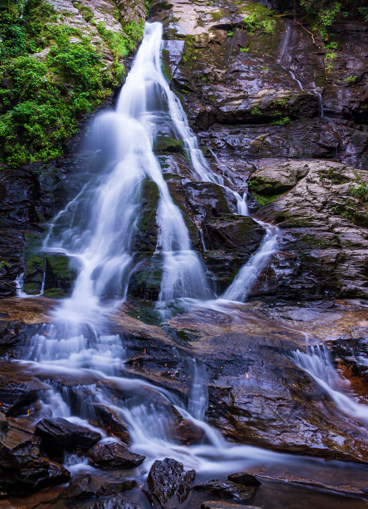 Water cascades over High Shoals Falls in Hiawassee, Georgia