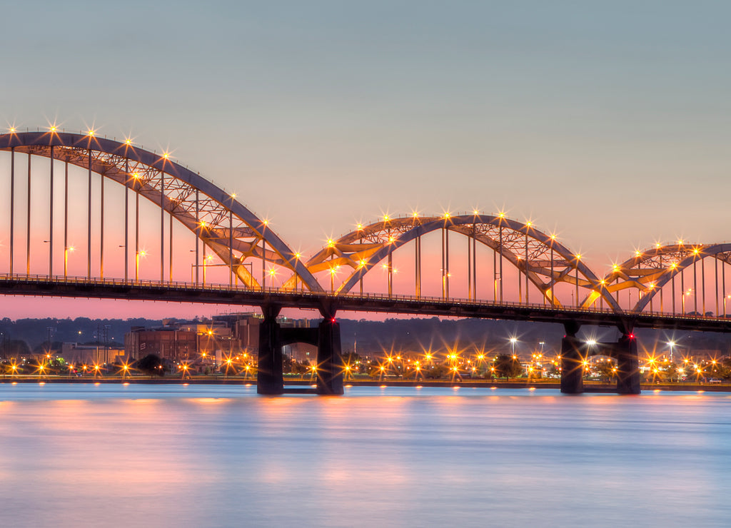 Centennial Bridge across the Mississippi River at dusk between Rock Island, Illinois and Davenport, Iowa USA
