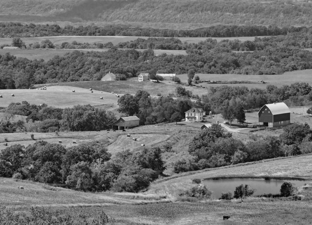 Family farms dot the landscape of northeaastern Iowa in black white