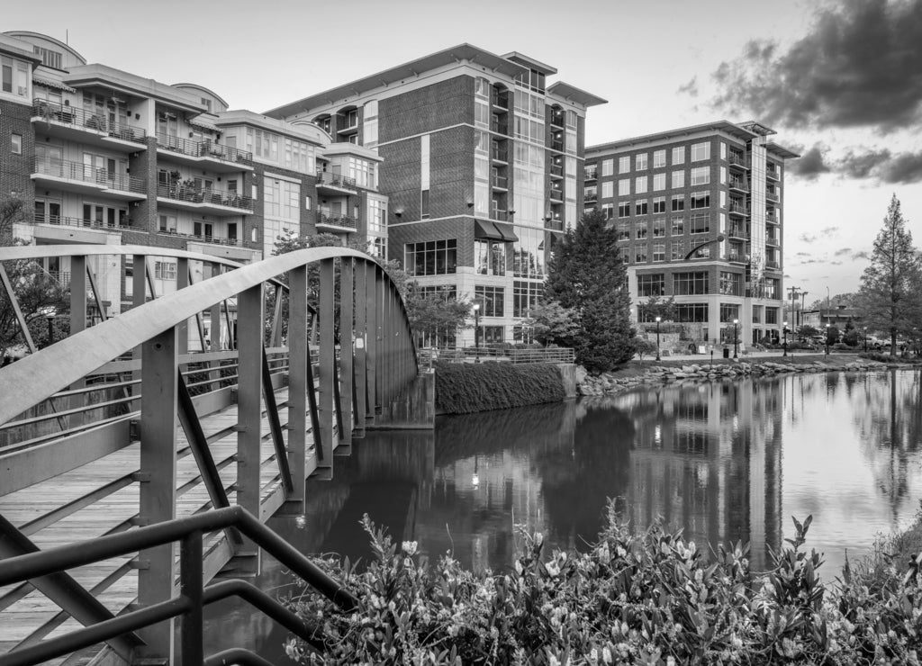 Greenville, South Carolina, USA downtown cityscape on the Reedy River at dusk in black white