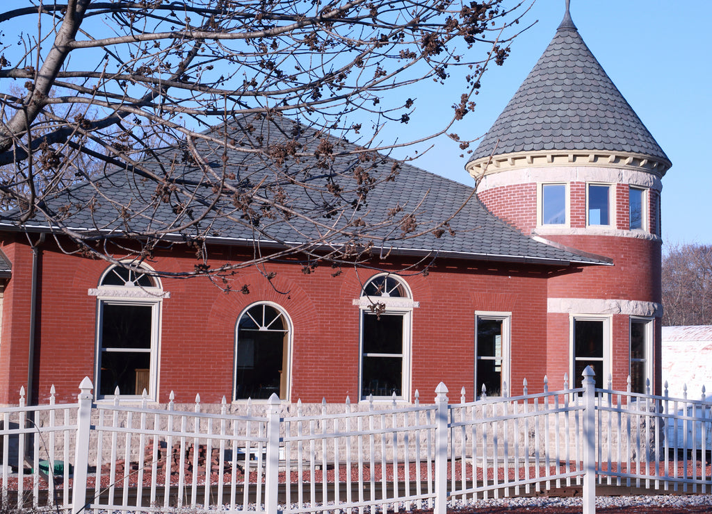 Historic railroad station at the track crossing in Grinnell, Iowa USA