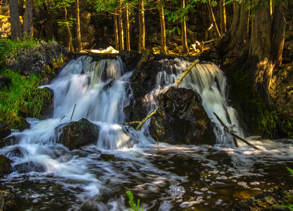 Upper Peninsula Michigan Roadside Waterfall. Fumee Falls is a beautiful waterfall located in a roadside park along US-2 in Dickinson County in the Upper Peninsula of Michigan