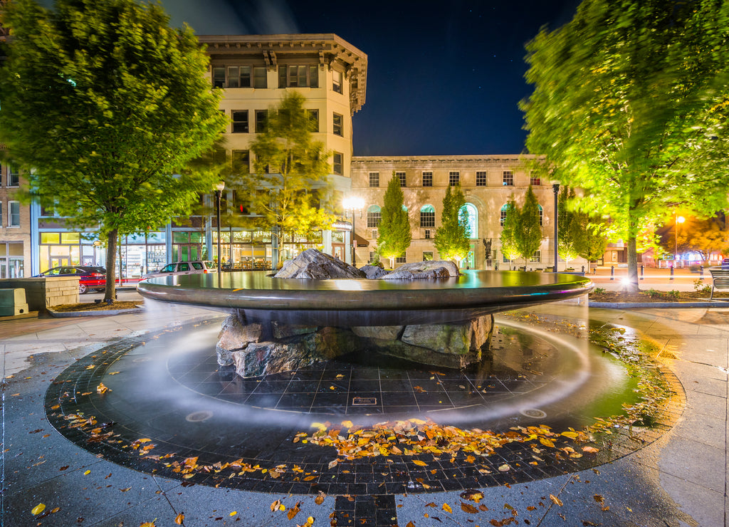 Fountain and buildings at Pack Square at night, in downtown Ashe North Carolina